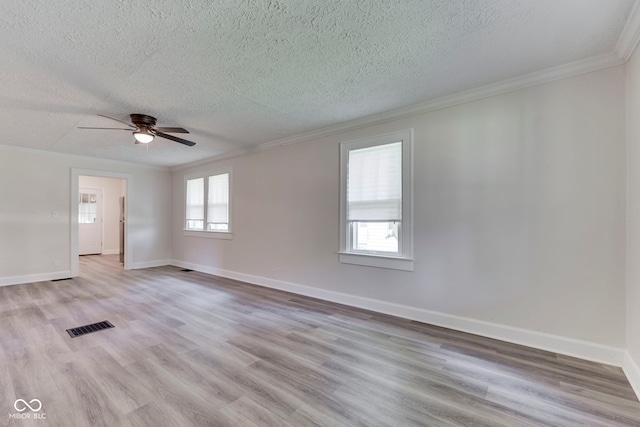 2245 N Ritter Ave, Indianapolis, IN 46218 - spare room featuring ornamental molding, a textured ceiling, wood finished floors, and a ceiling fan