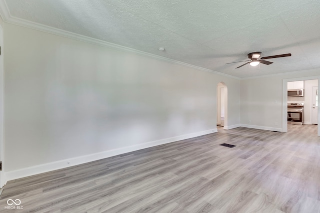 2245 N Ritter Ave, Indianapolis, IN 46218 - unfurnished living room featuring arched walkways, a ceiling fan, light wood-style floors, ornamental molding, and a textured ceiling