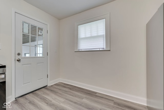 2245 N Ritter Ave, Indianapolis, IN 46218 - doorway to outside featuring healthy amount of natural light and light wood-type flooring