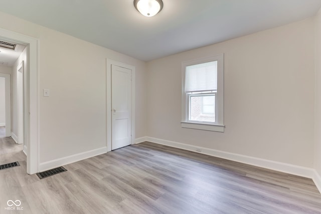2245 N Ritter Ave, Indianapolis, IN 46218 - empty room with light wood-style floors and baseboards