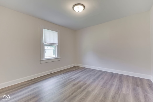 2245 N Ritter Ave, Indianapolis, IN 46218 - spare room with wood finished floors and baseboards