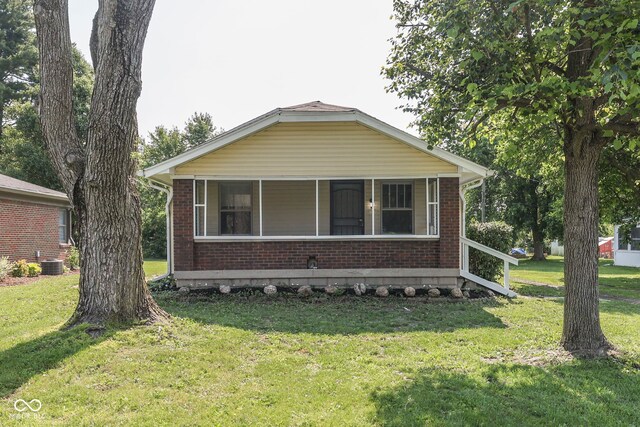 2245 N Ritter Ave, Indianapolis, IN 46218 - bungalow featuring brick siding and a front yard