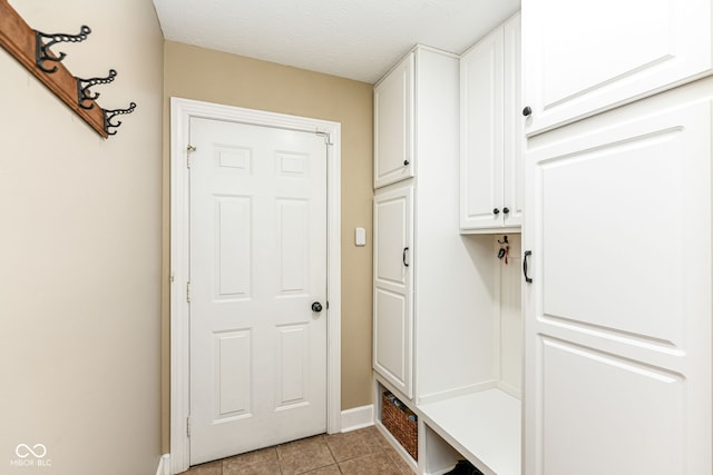 9825 Covington Blvd, Fishers, IN 46037 - mudroom with light tile patterned floors and baseboards