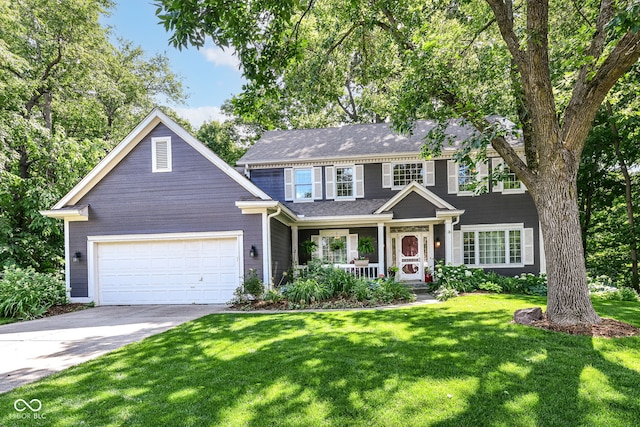 9825 Covington Blvd, Fishers, IN 46037 - view of front of property with driveway, an attached garage, a front yard, and a porch