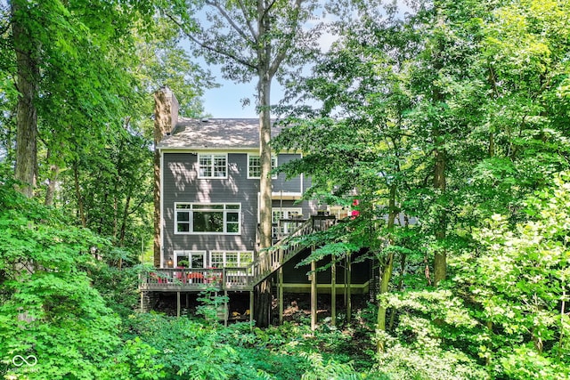 9825 Covington Blvd, Fishers, IN 46037 - rear view of property featuring a deck, a chimney, and stairs