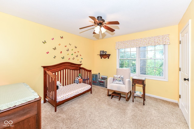 9825 Covington Blvd, Fishers, IN 46037 - bedroom featuring carpet, a ceiling fan, and a crib