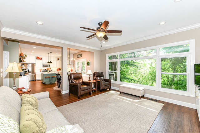 9825 Covington Blvd, Fishers, IN 46037 - living room featuring ceiling fan, dark wood-style floors, recessed lighting, and ornamental molding