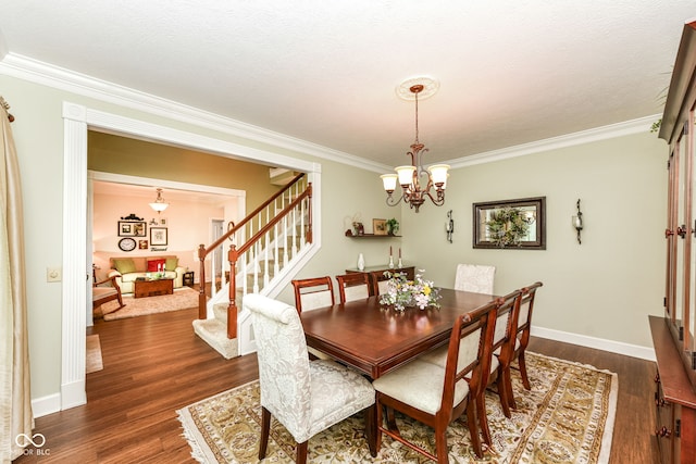 9825 Covington Blvd, Fishers, IN 46037 - dining space with stairway, crown molding, dark wood-style flooring, and a chandelier