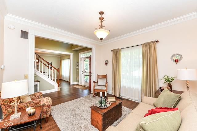 9825 Covington Blvd, Fishers, IN 46037 - living area with ornamental molding, dark wood-type flooring, and stairs
