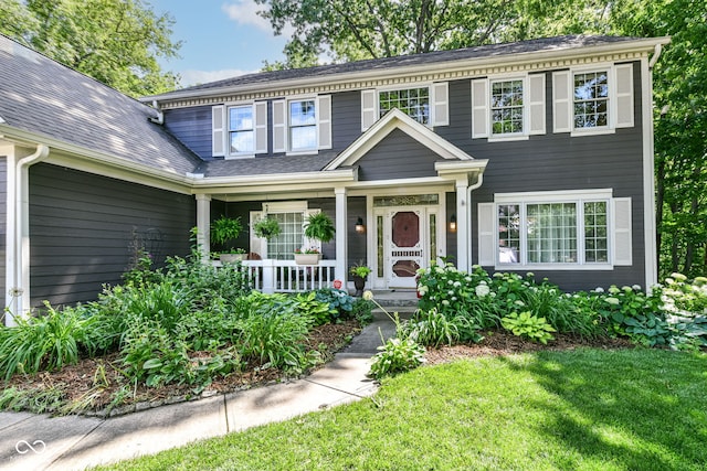 9825 Covington Blvd, Fishers, IN 46037 - view of front of home featuring covered porch and a front lawn