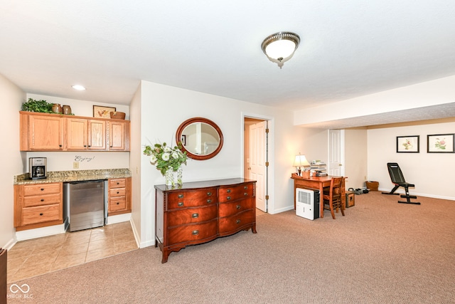 9825 Covington Blvd, Fishers, IN 46037 - kitchen with light carpet, refrigerator, light stone countertops, and recessed lighting