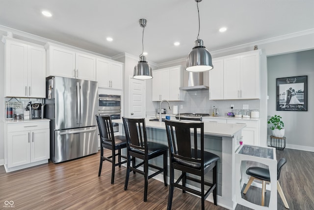 3839 Albert Ln, Bargersville, IN 46106 - kitchen with appliances with stainless steel finishes, decorative backsplash, light countertops, a center island with sink, and dark wood-style floors