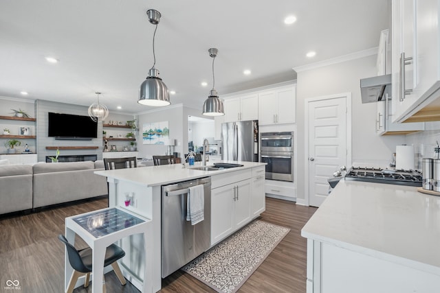 3839 Albert Ln, Bargersville, IN 46106 - kitchen with appliances with stainless steel finishes, ornamental molding, light countertops, open floor plan, and recessed lighting