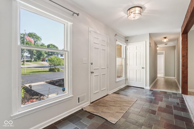 7029 Kingswood Cir, Indianapolis, IN 46256 - entryway featuring stone tile flooring and baseboards