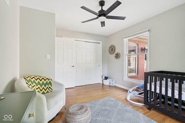 7029 Kingswood Cir, Indianapolis, IN 46256 - bedroom with wood finished floors, a closet, and a ceiling fan