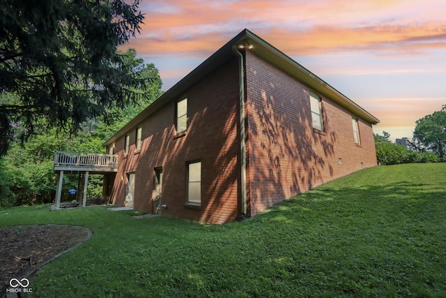 7029 Kingswood Cir, Indianapolis, IN 46256 - view of property exterior with brick siding, a wooden deck, and a lawn