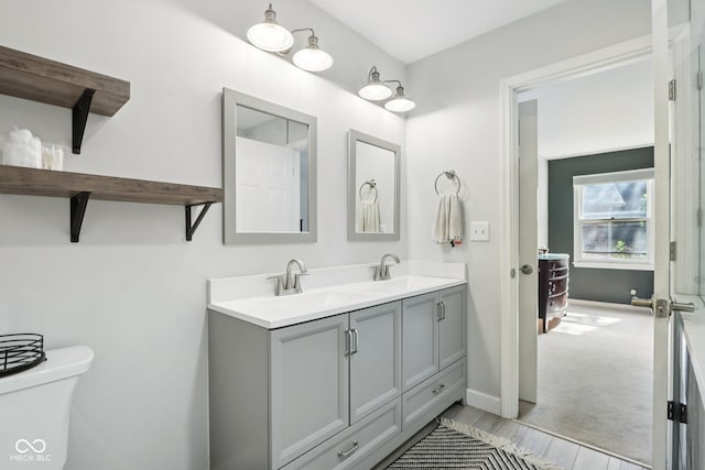 7029 Kingswood Cir, Indianapolis, IN 46256 - bathroom with double vanity and wood finished floors