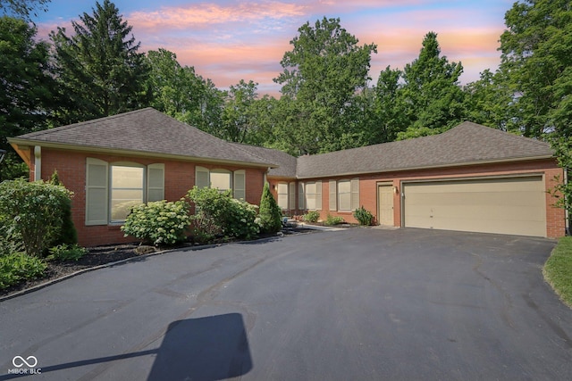 7029 Kingswood Cir, Indianapolis, IN 46256 - ranch-style home with brick siding, driveway, and a garage