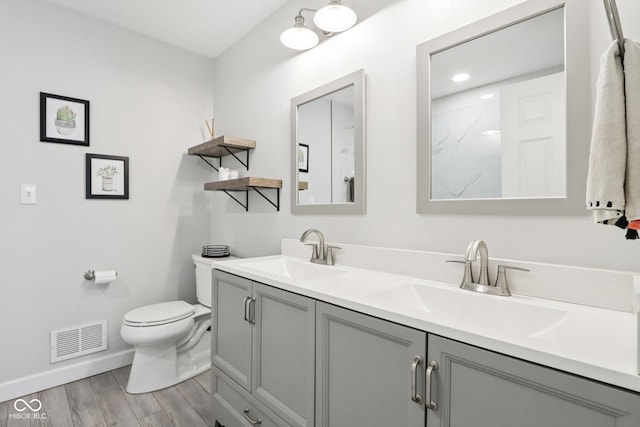 7029 Kingswood Cir, Indianapolis, IN 46256 - full bathroom featuring double vanity, wood finished floors, and a shower
