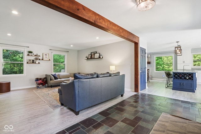 7029 Kingswood Cir, Indianapolis, IN 46256 - living room with recessed lighting, beamed ceiling, and stone finish floors