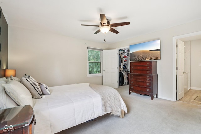 7029 Kingswood Cir, Indianapolis, IN 46256 - bedroom with carpet, a walk in closet, a ceiling fan, and a closet
