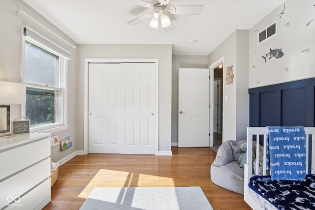 7029 Kingswood Cir, Indianapolis, IN 46256 - bedroom with light wood-style floors, a closet, and ceiling fan