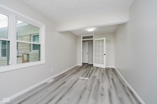 91 N Raceway Rd, Indianapolis, IN 46234 - empty room featuring french doors and wood finished floors