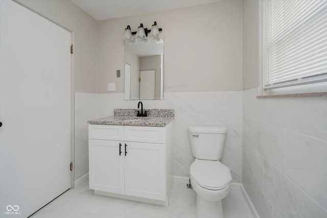 91 N Raceway Rd, Indianapolis, IN 46234 - bathroom with vanity and a wainscoted wall