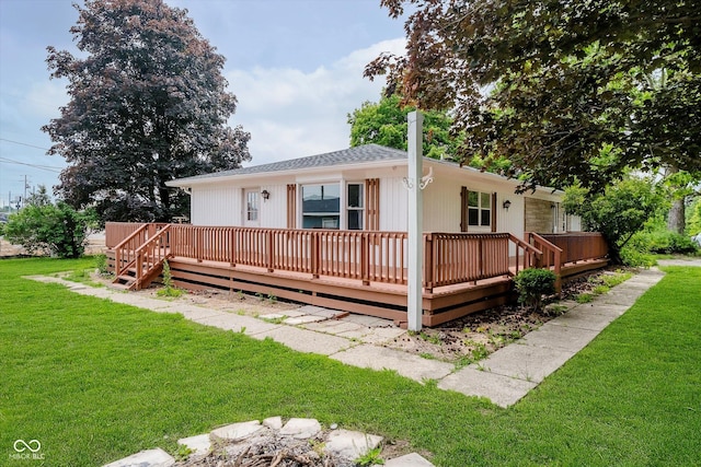 91 N Raceway Rd, Indianapolis, IN 46234 - view of front of home with a front lawn and a wooden deck