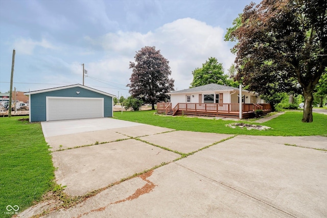 91 N Raceway Rd, Indianapolis, IN 46234 - view of front of home featuring a garage, an outdoor structure, a wooden deck, and a front lawn