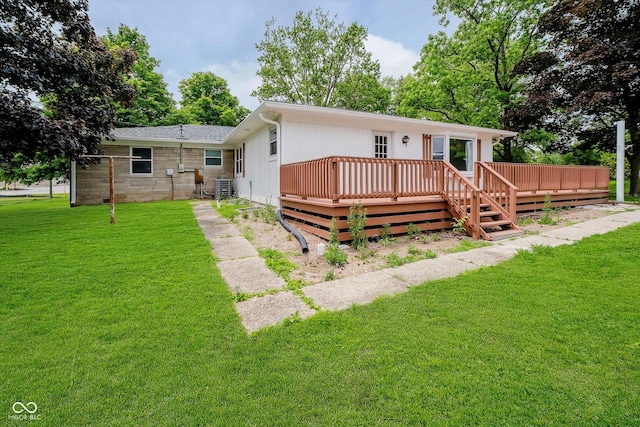 91 N Raceway Rd, Indianapolis, IN 46234 - rear view of property featuring a wooden deck and a lawn