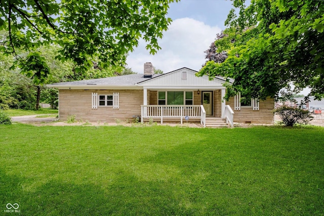 91 N Raceway Rd, Indianapolis, IN 46234 - view of front of home featuring a porch, a chimney, and a front yard