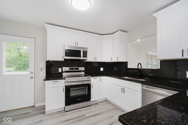 91 N Raceway Rd, Indianapolis, IN 46234 - kitchen with appliances with stainless steel finishes, white cabinets, and tasteful backsplash