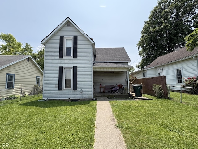 1809 E 13th St, Muncie, IN 47302 - rear view of property featuring a shingled roof and a porch