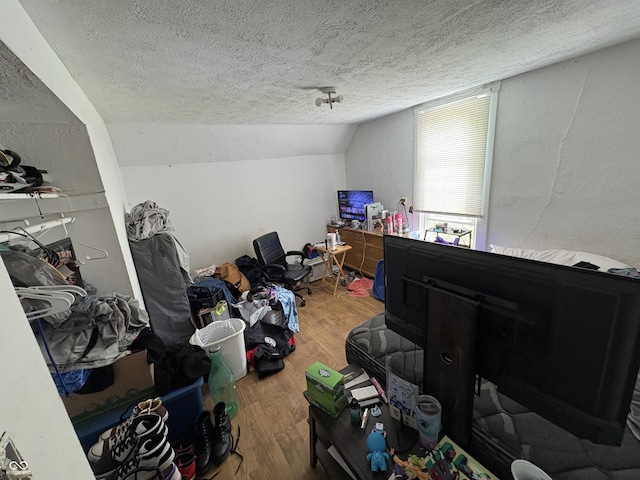 1809 E 13th St, Muncie, IN 47302 - bonus room with a textured ceiling, wood finished floors, and vaulted ceiling
