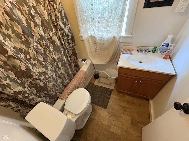 1809 E 13th St, Muncie, IN 47302 - full bathroom featuring vanity, wood finished floors, and shower / tub combo