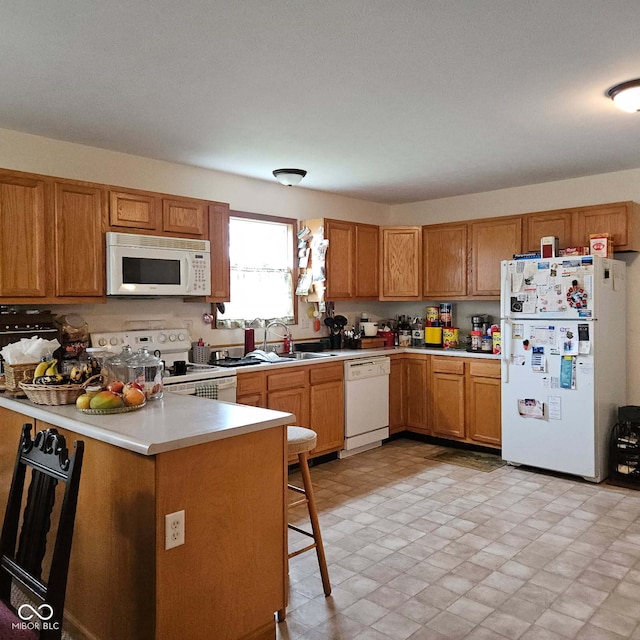 1674 W Independence St, Greensburg, IN 47240 - kitchen with white appliances, light countertops, and brown cabinets