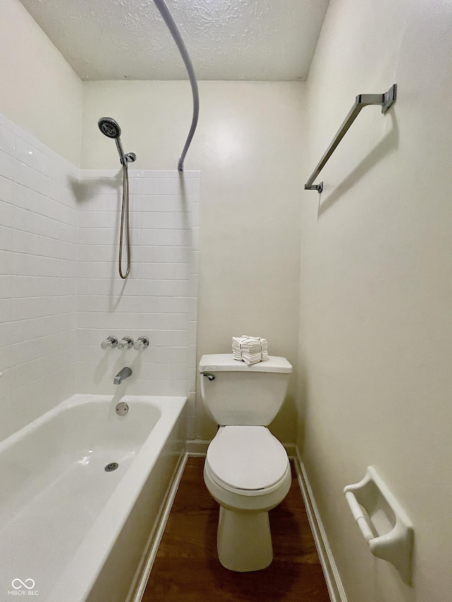 7392 S Meridian St, Indianapolis, IN 46217 - bathroom featuring wood finished floors, shower / tub combination, and a textured ceiling