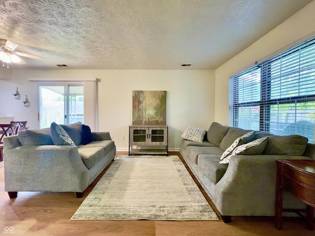 7392 S Meridian St, Indianapolis, IN 46217 - living area featuring ceiling fan, a textured ceiling, and wood finished floors