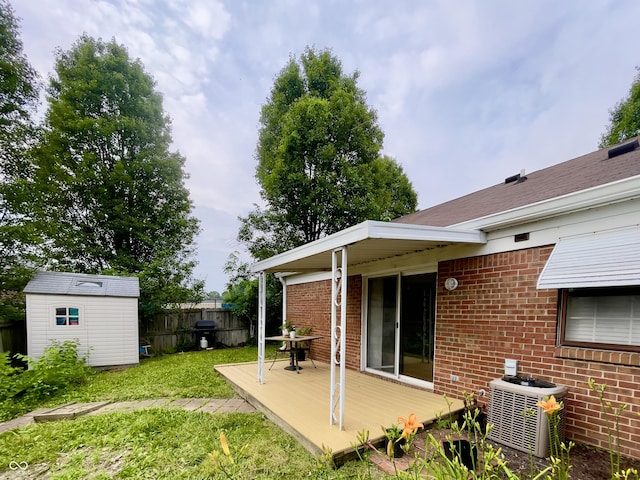 7392 S Meridian St, Indianapolis, IN 46217 - view of yard featuring a wooden deck and a storage unit