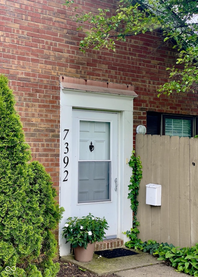 7392 S Meridian St, Indianapolis, IN 46217 - doorway to property with brick siding