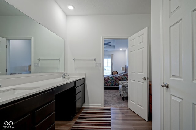 6608 W Shoreline Ct, Greenfield, IN 46140 - full bath featuring connected bathroom, double vanity, wood finished floors, and recessed lighting