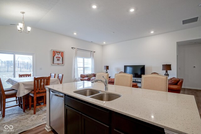 6608 W Shoreline Ct, Greenfield, IN 46140 - kitchen featuring dishwasher, open floor plan, dark wood finished floors, a kitchen island with sink, and recessed lighting