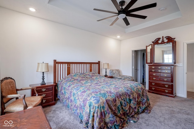 6608 W Shoreline Ct, Greenfield, IN 46140 - carpeted bedroom with a tray ceiling, recessed lighting, and ceiling fan