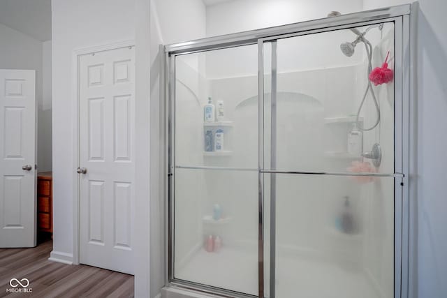 6608 W Shoreline Ct, Greenfield, IN 46140 - bathroom featuring wood finished floors and a shower stall