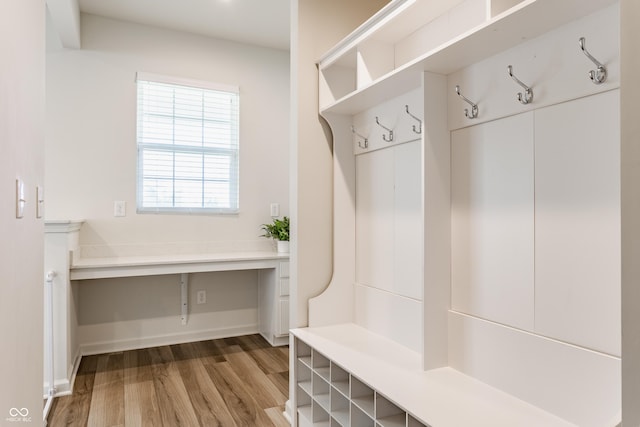 6537 Seabiscuit Rd, Whitestown, IN 46075 - mudroom featuring wood finished floors and baseboards