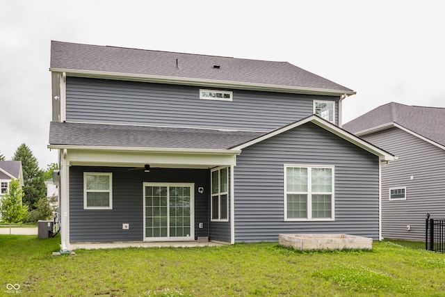 6537 Seabiscuit Rd, Whitestown, IN 46075 - rear view of house with a lawn, a ceiling fan, and roof with shingles