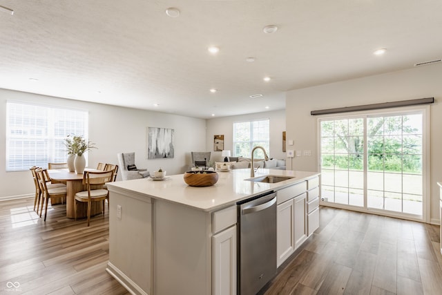 6537 Seabiscuit Rd, Whitestown, IN 46075 - kitchen featuring dishwasher, light wood finished floors, recessed lighting, a center island with sink, and white cabinets
