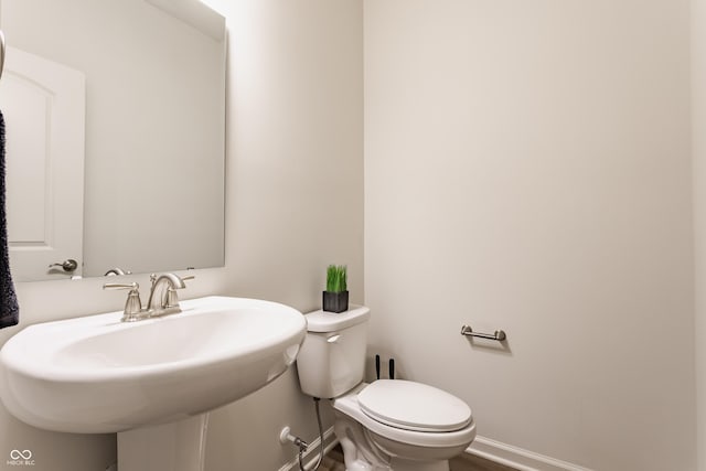 6537 Seabiscuit Rd, Whitestown, IN 46075 - half bathroom with toilet and a sink