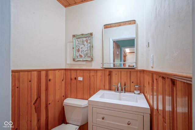 1524 Northcrest Dr, Anderson, IN 46012 - bathroom with a wainscoted wall, vanity, and wood walls